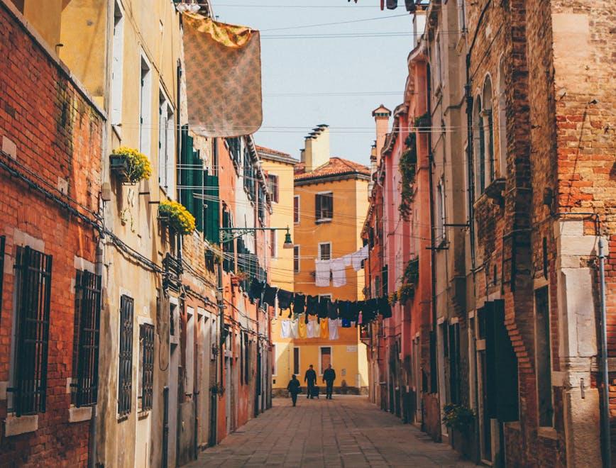 urban street building city road person path walkway alley flagstone