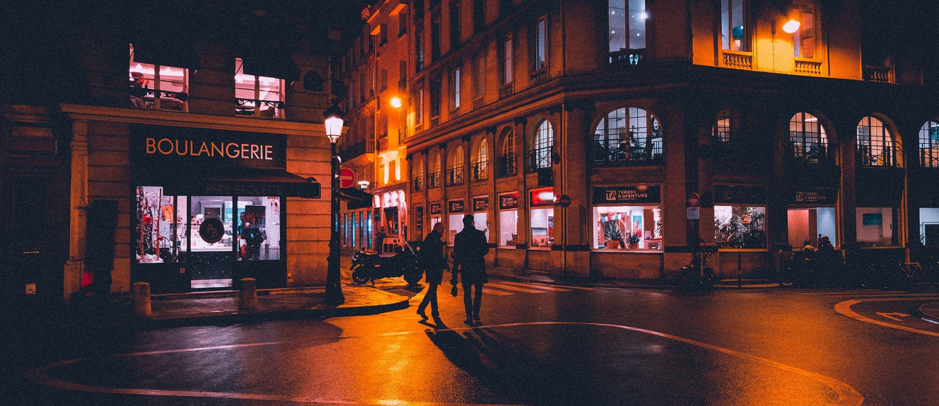 pedestrian person tarmac road downtown urban building city intersection architecture