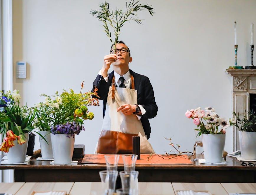 copyright: gio staiano ikebana workshop with mr. watarai loewe-ikebana-12-4-19 milano person plant flower flower arrangement flower bouquet pottery ikebana vase ornament jar