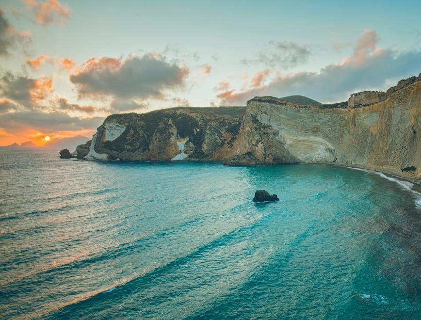 nature water sea outdoors cliff promontory shoreline land coast scenery