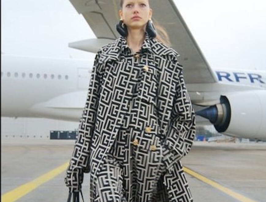 clothing apparel coat airplane transportation vehicle aircraft person human