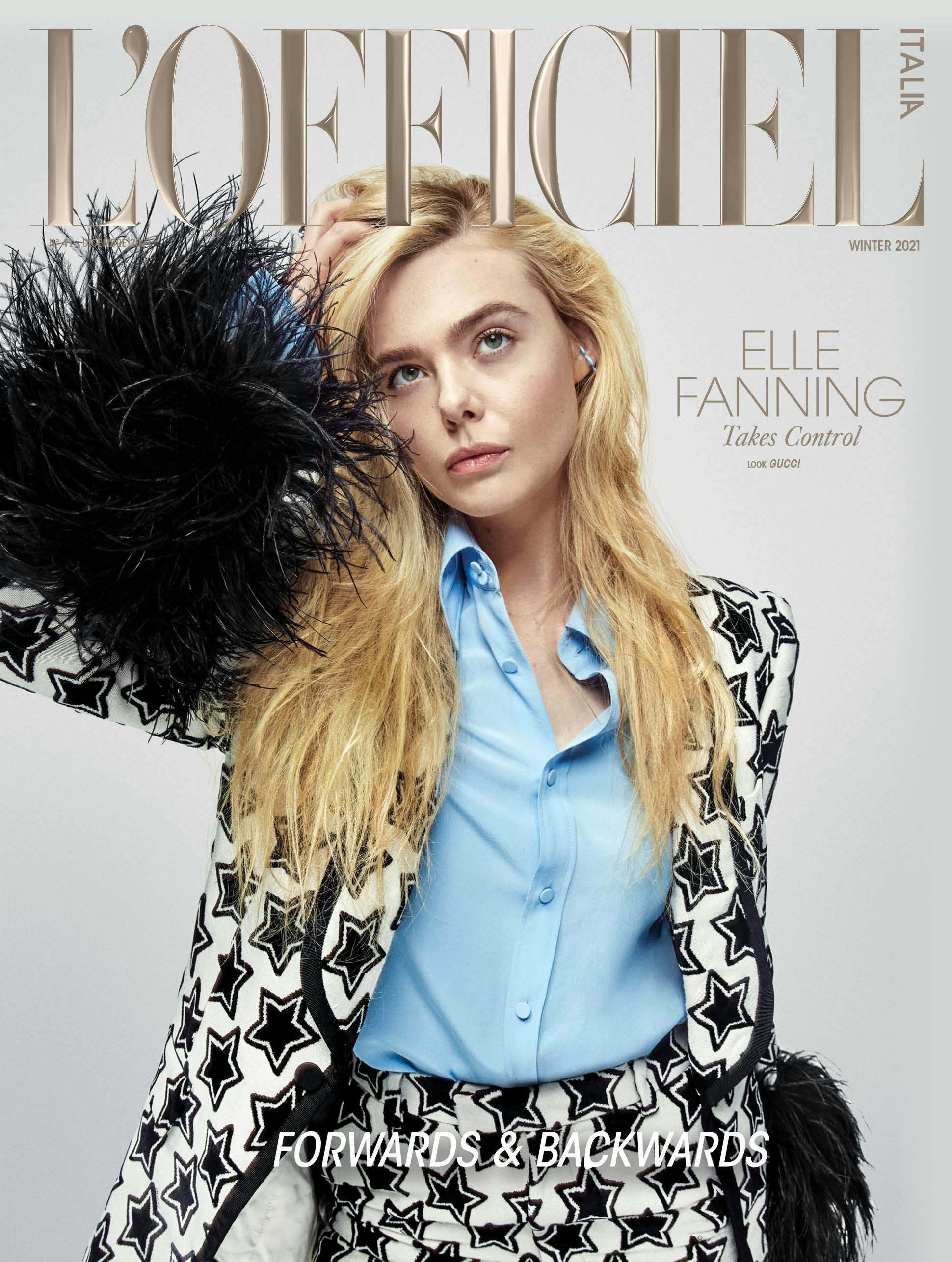 Elle Fanning in cover indossa completo maschile stampato con polsini di piume fake e camicia, GUCCI; orecchino e anello, BEA BONGIASCA.