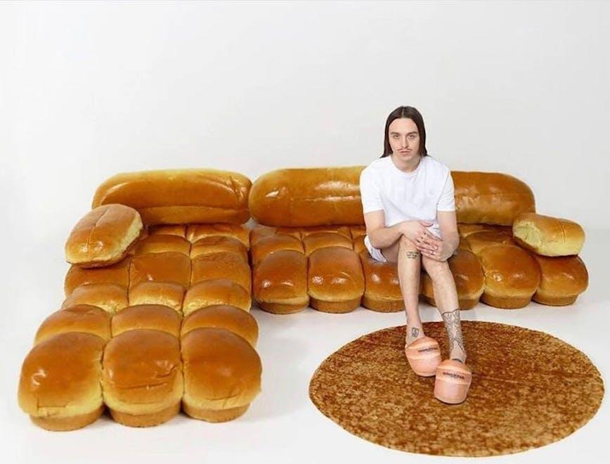 person human bread food bun