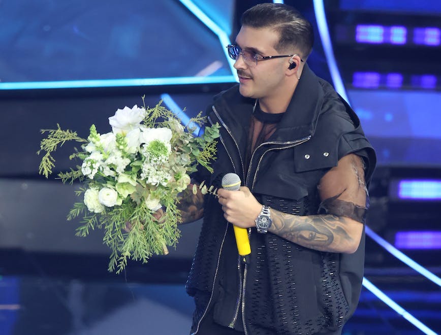 sanremo flower flower arrangement flower bouquet microphone person tattoo solo performance adult male man