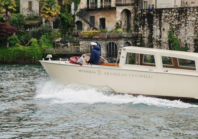 vehicle watercraft yacht boat neighborhood person water waterfront boating outdoors