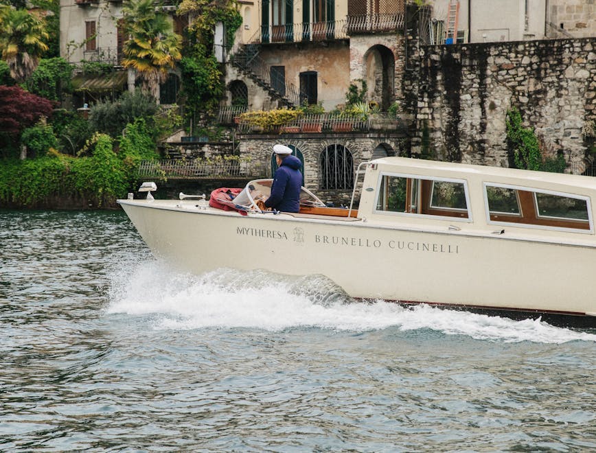 vehicle watercraft yacht boat neighborhood person water waterfront boating outdoors