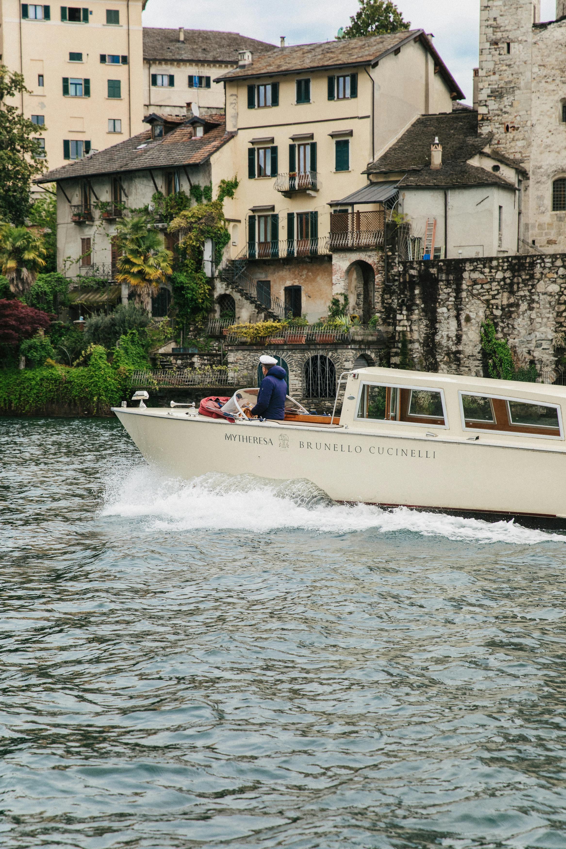 vehicle watercraft yacht boat neighborhood person water waterfront boating outdoors