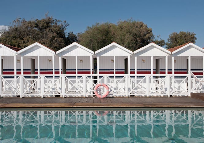 water waterfront hotel resort pier shelter housing porch pool nature