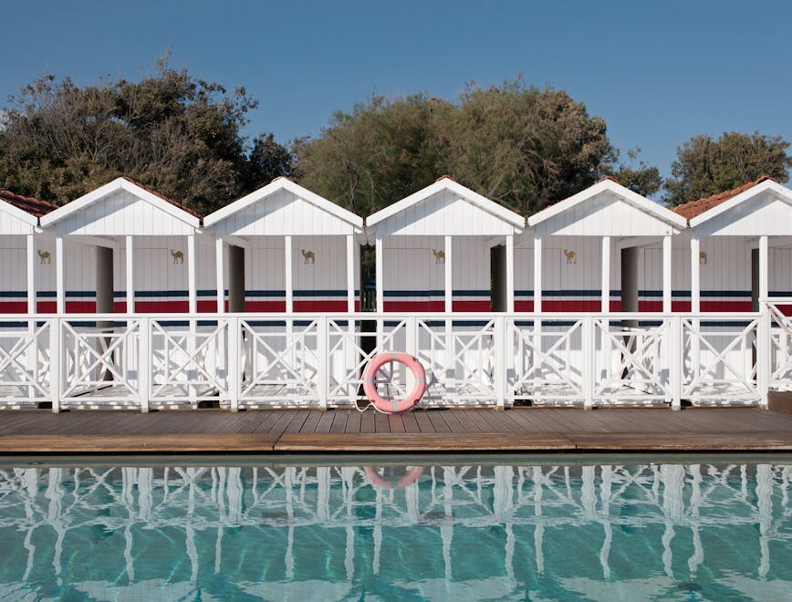 water waterfront hotel resort pier shelter housing porch pool nature