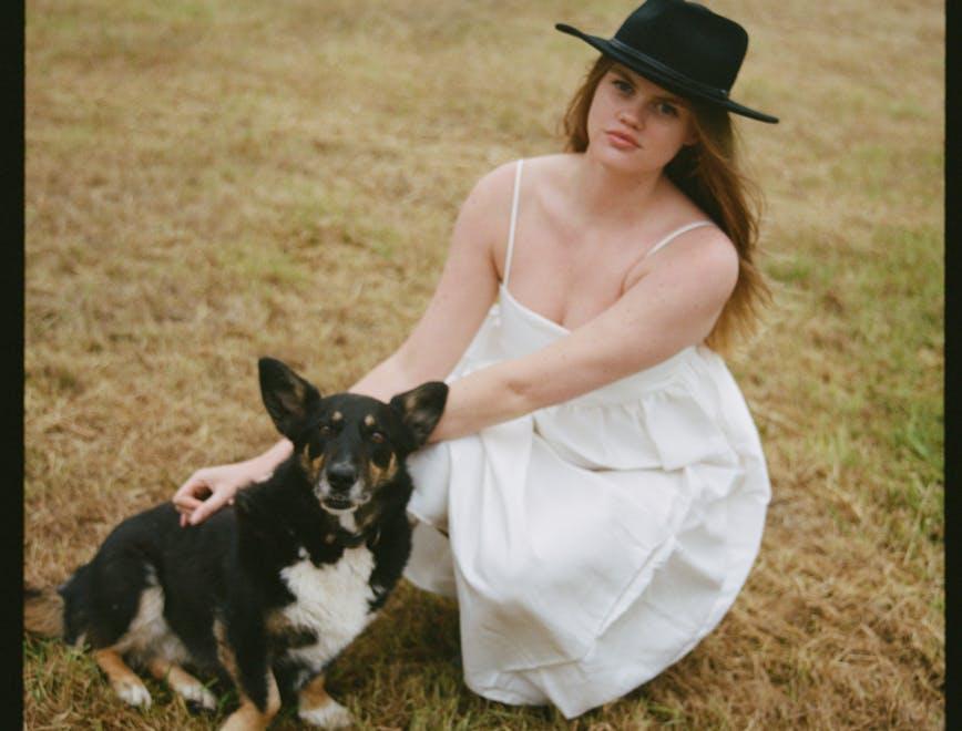 hat dress adult female person woman sun hat formal wear dog grass